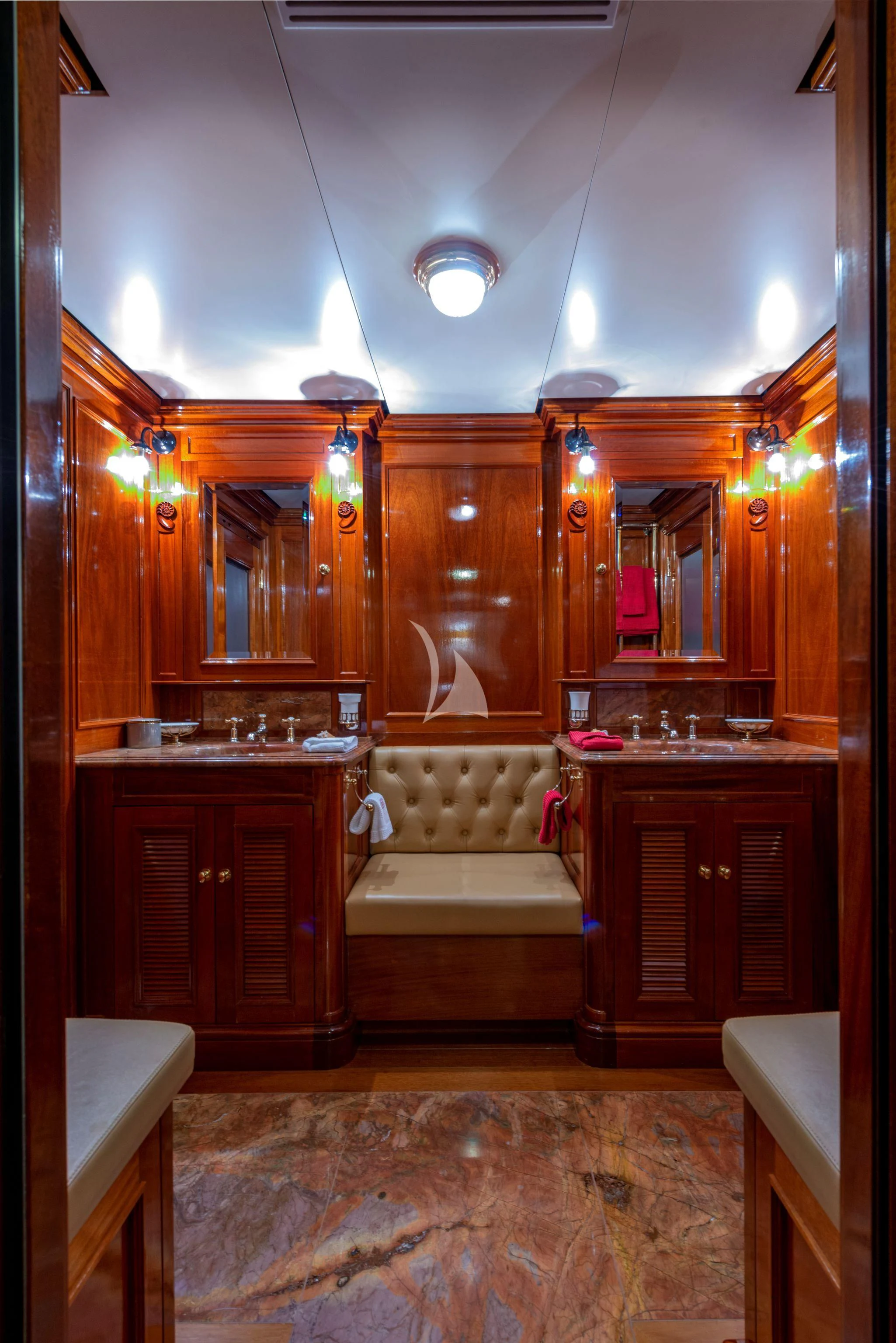 a bathroom with a sink and a chair aboard STEEL Yacht for Sale