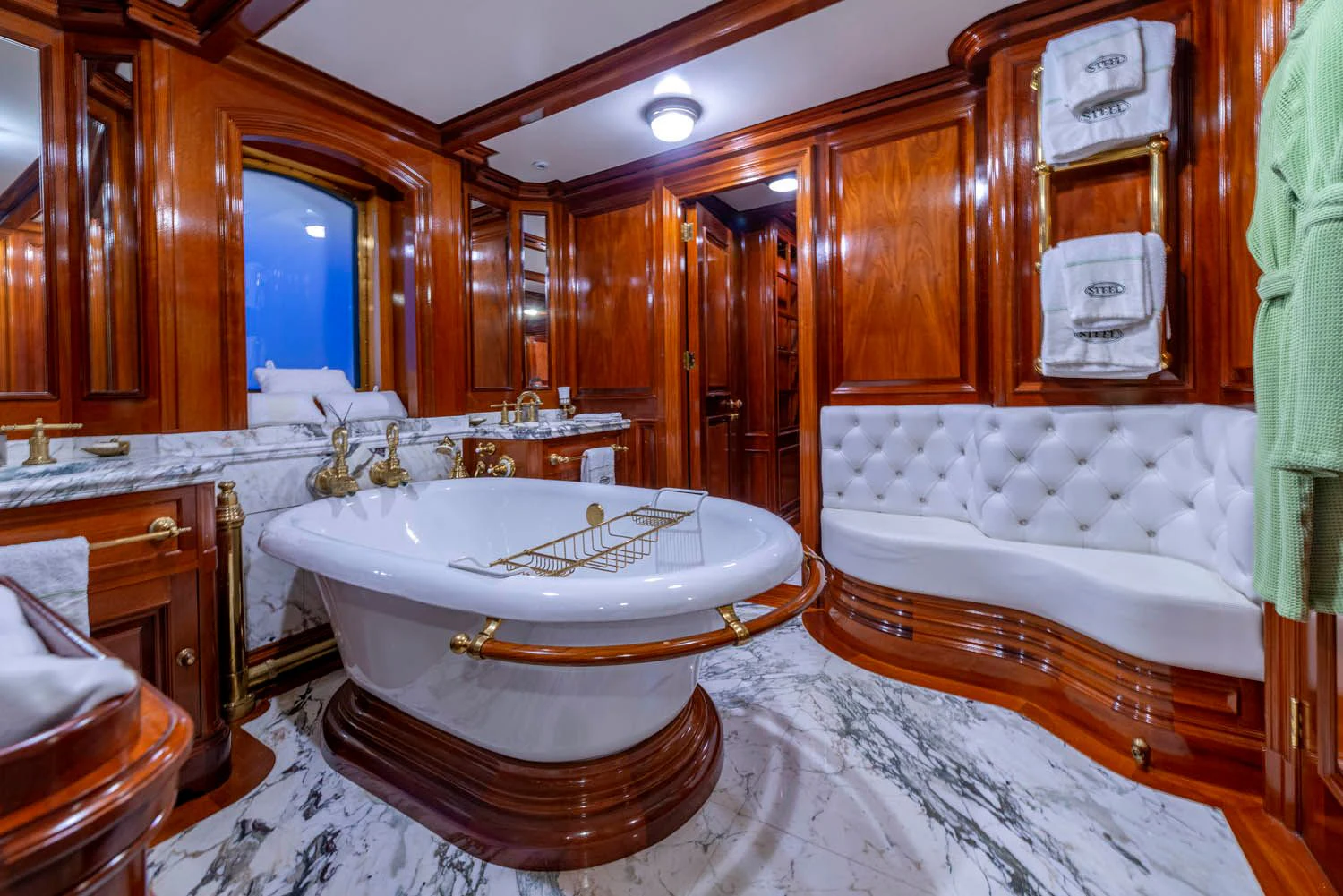 a bathroom with a bathtub and a sink aboard STEEL Yacht for Sale