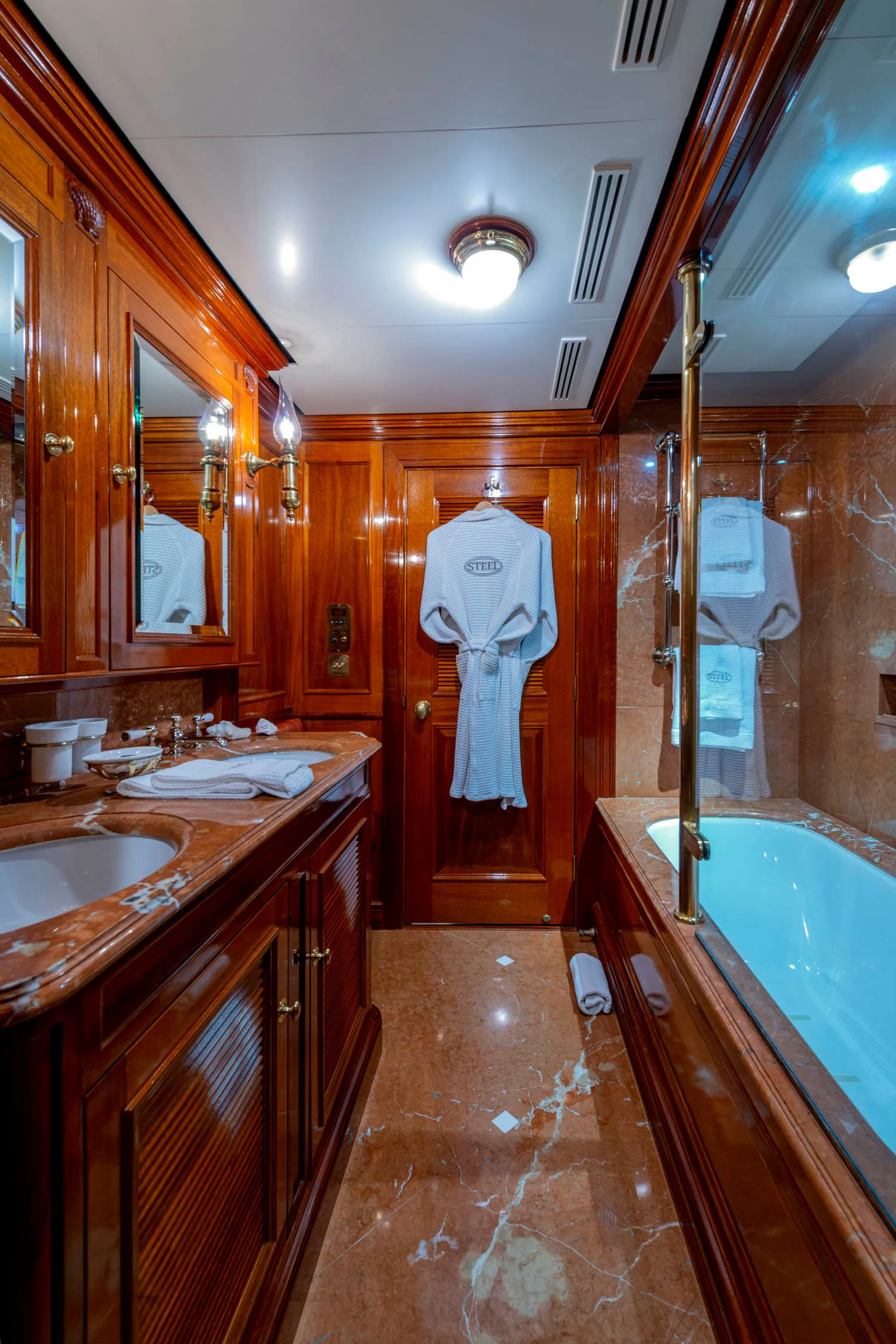 a bathroom with a sink and a bathtub aboard STEEL Yacht for Sale