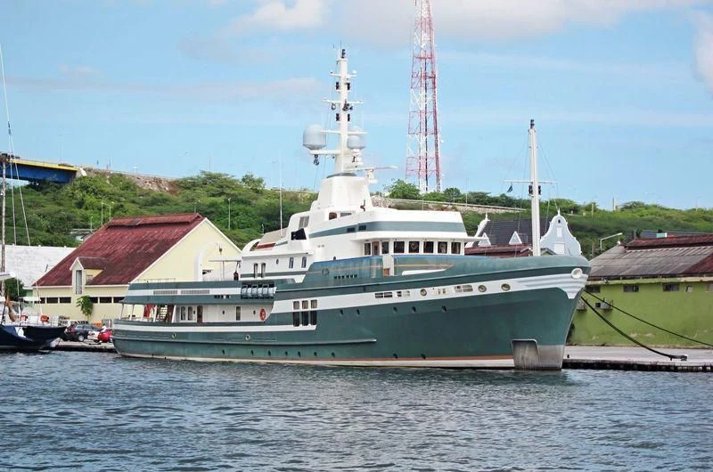 a large ship in the water aboard STEEL Yacht for Sale