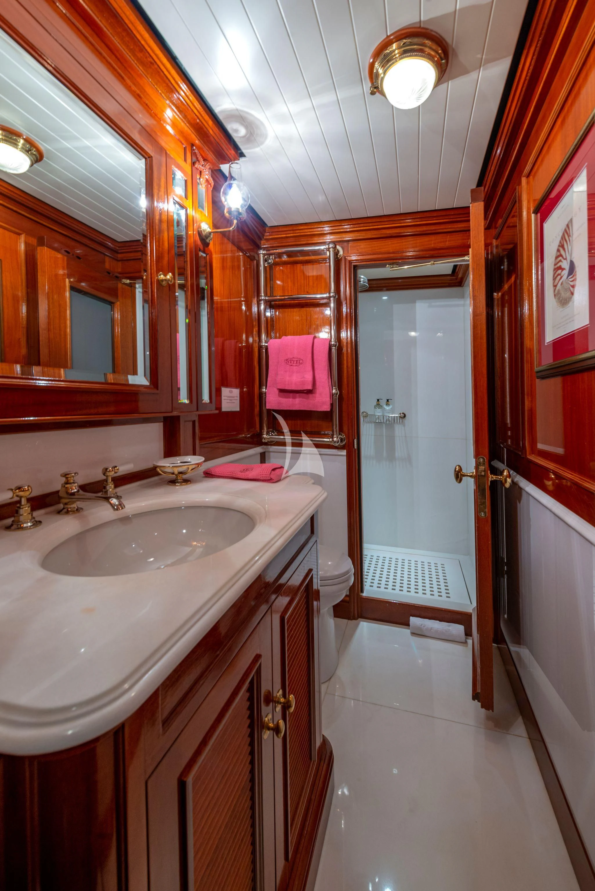 a bathroom with a sink and a mirror aboard STEEL Yacht for Sale