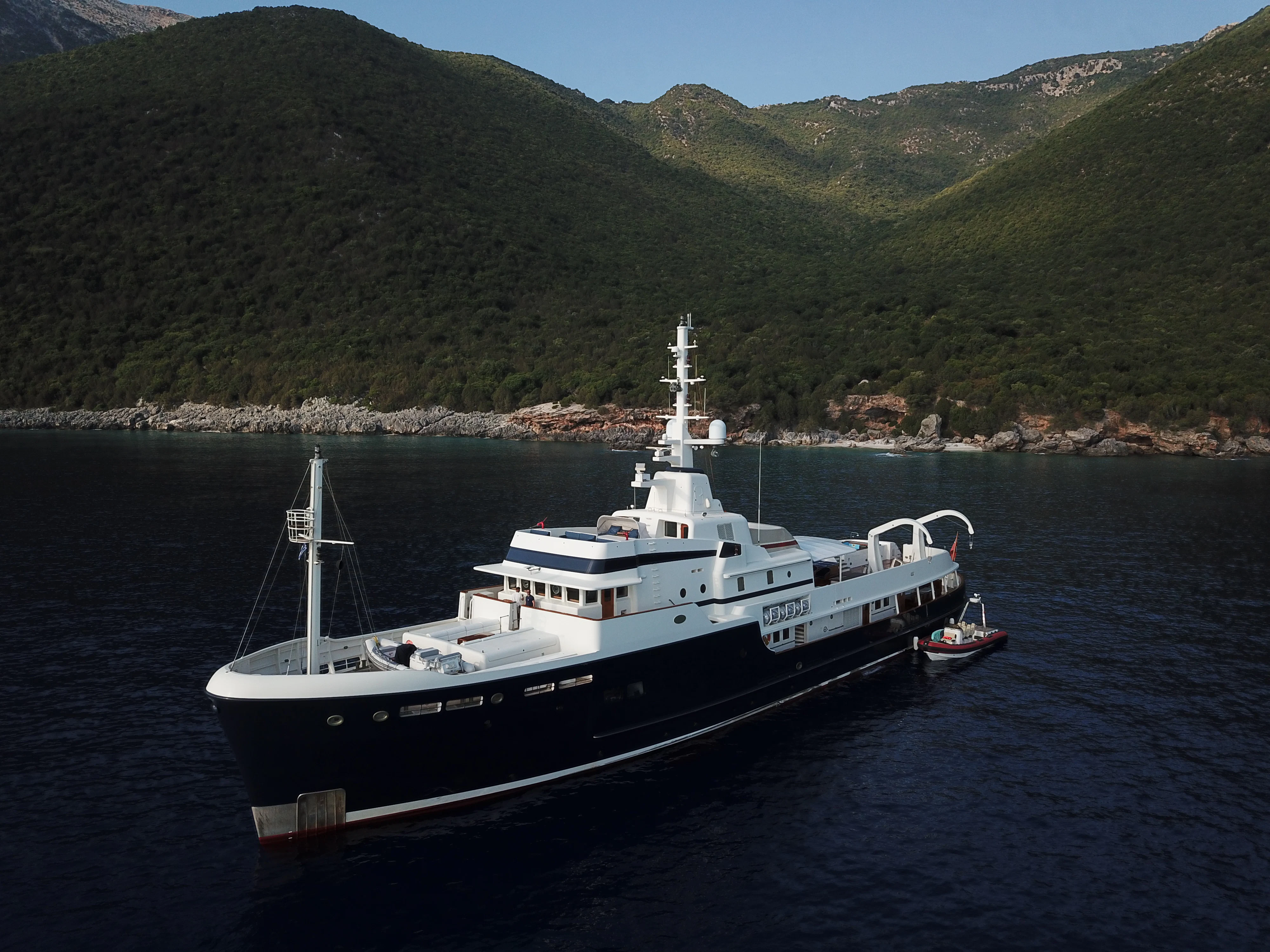 a large ship in the water aboard STEEL Yacht for Sale