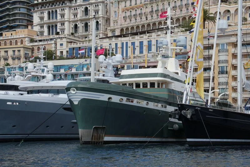 several boats docked in a harbor aboard STEEL Yacht for Sale