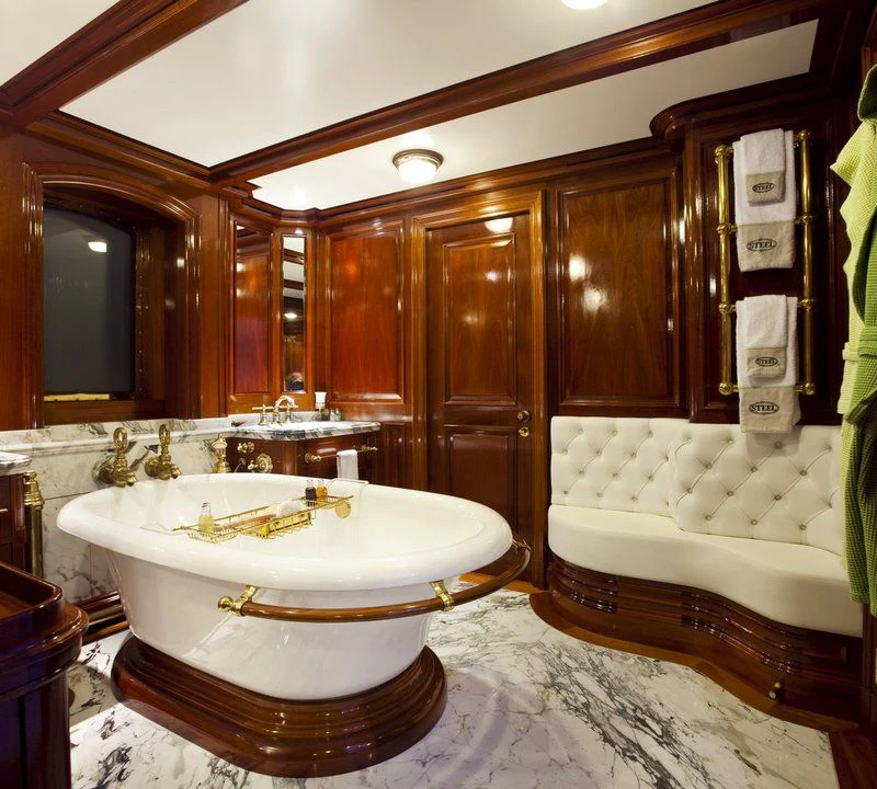 a bathroom with a tub and a sink aboard STEEL Yacht for Sale