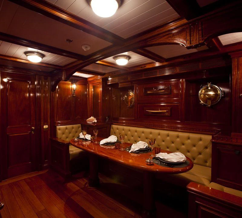 a bar with a table and chairs aboard STEEL Yacht for Sale