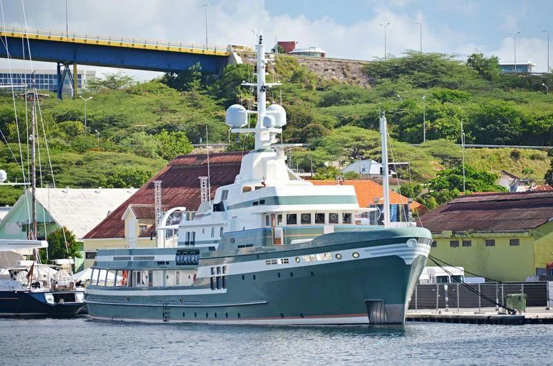 a large ship docked aboard STEEL Yacht for Sale