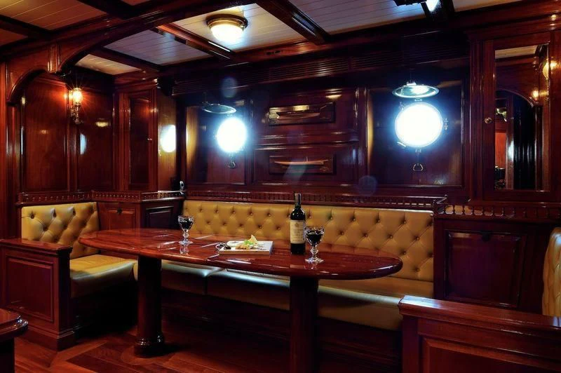 a large kitchen with a bar aboard STEEL Yacht for Sale