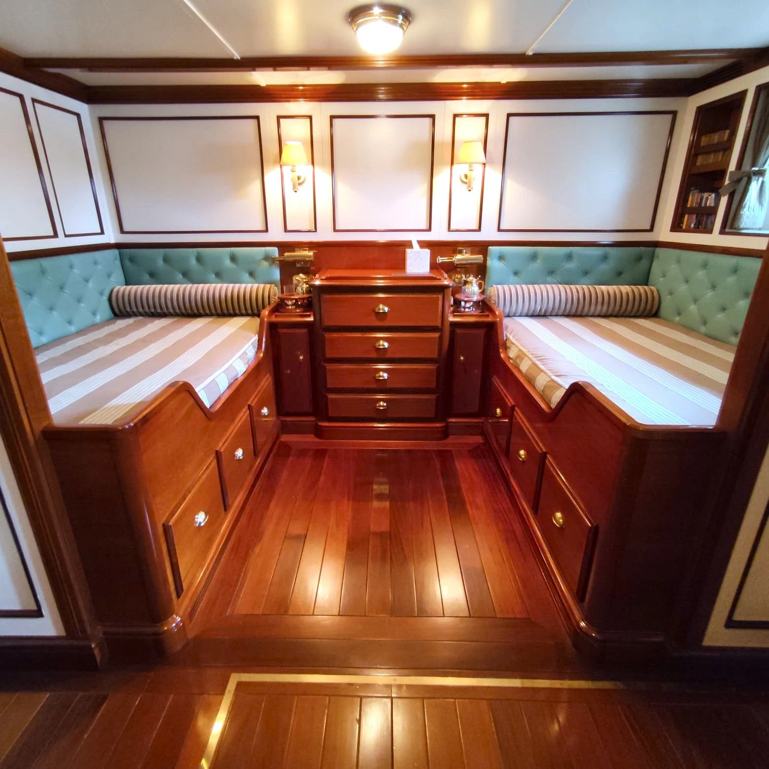 a room with wooden cabinets aboard STEEL Yacht for Sale