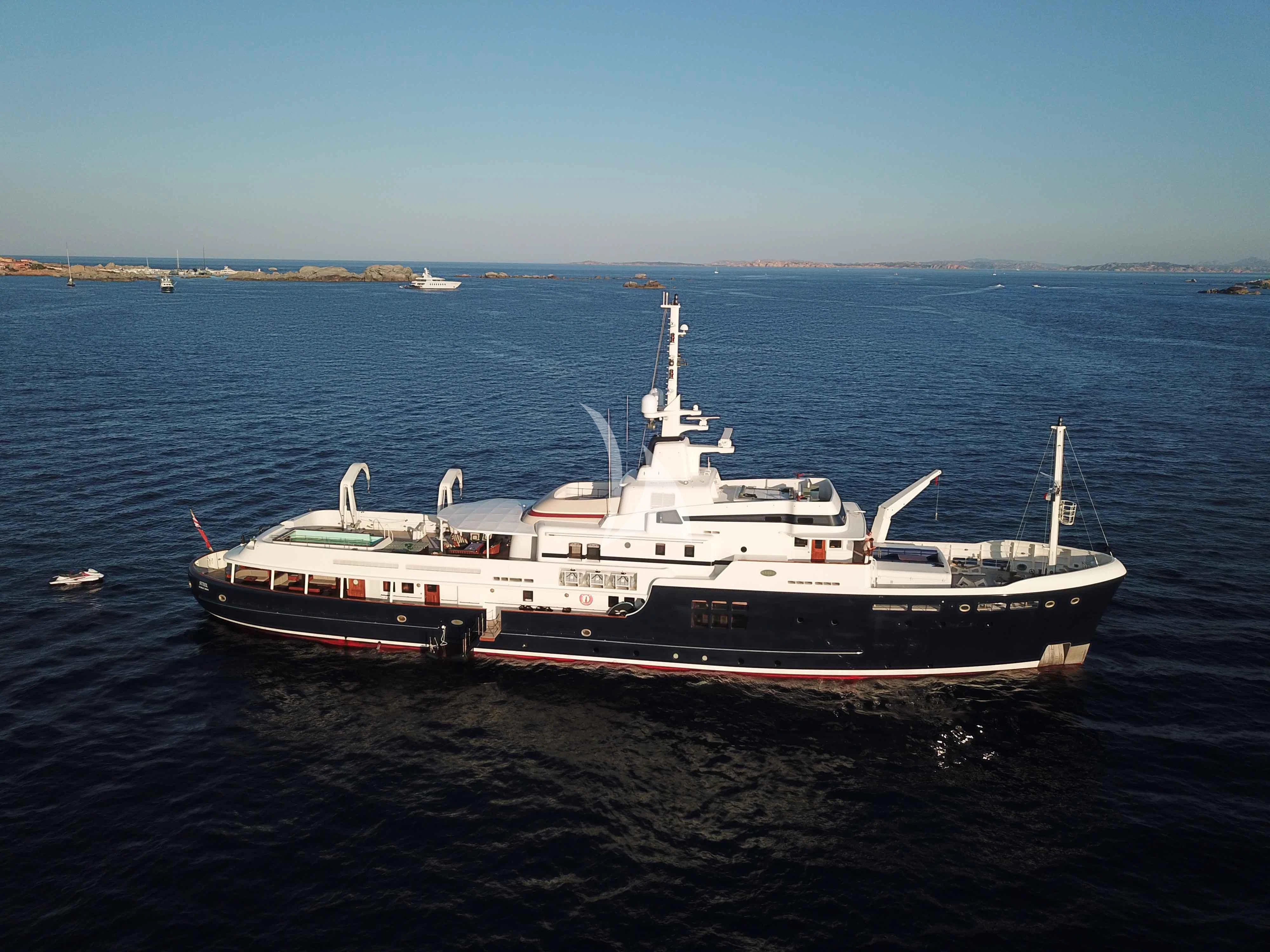 a large white boat in the water aboard STEEL Yacht for Sale