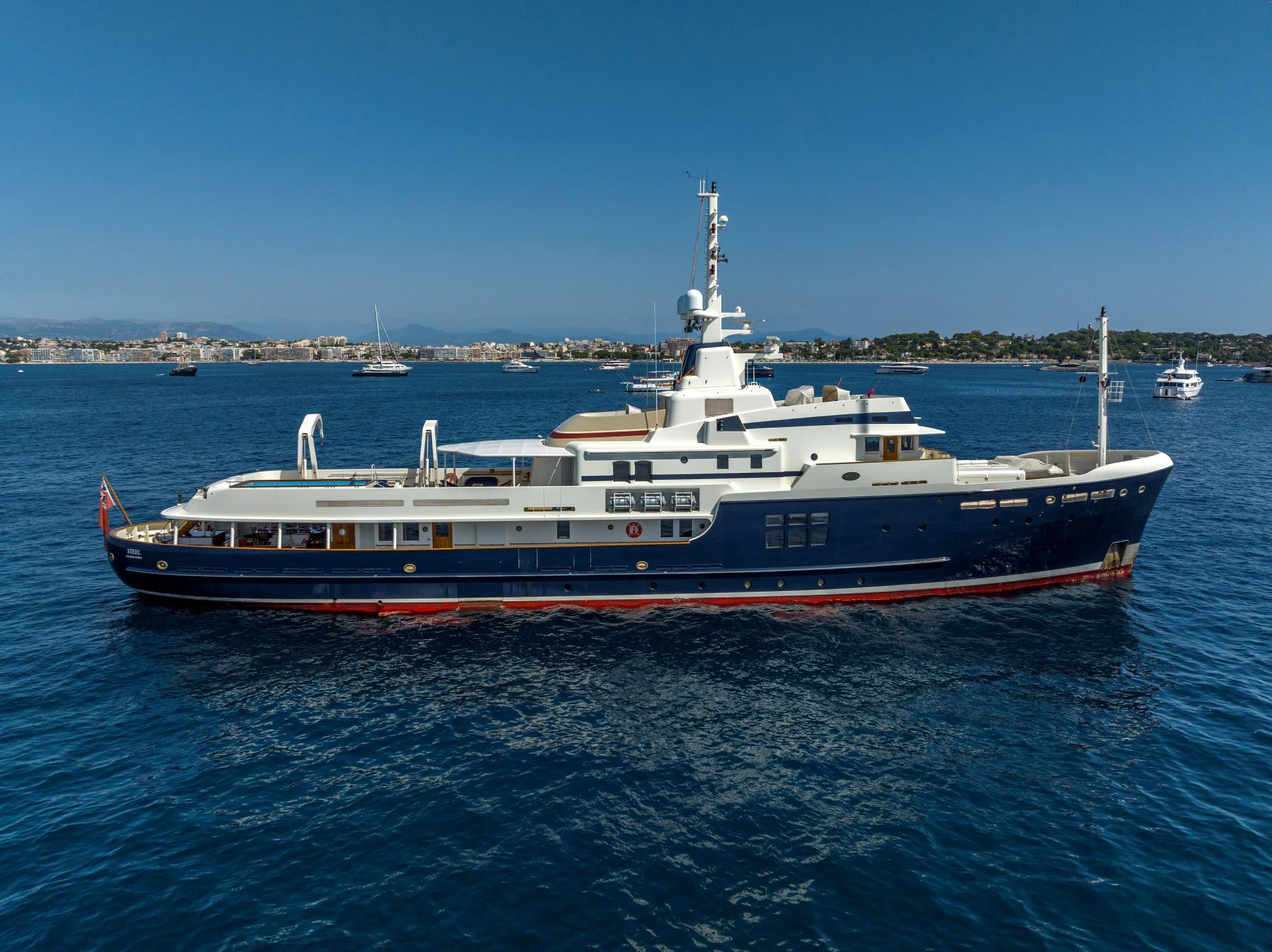 a large boat in the water aboard STEEL Yacht for Sale