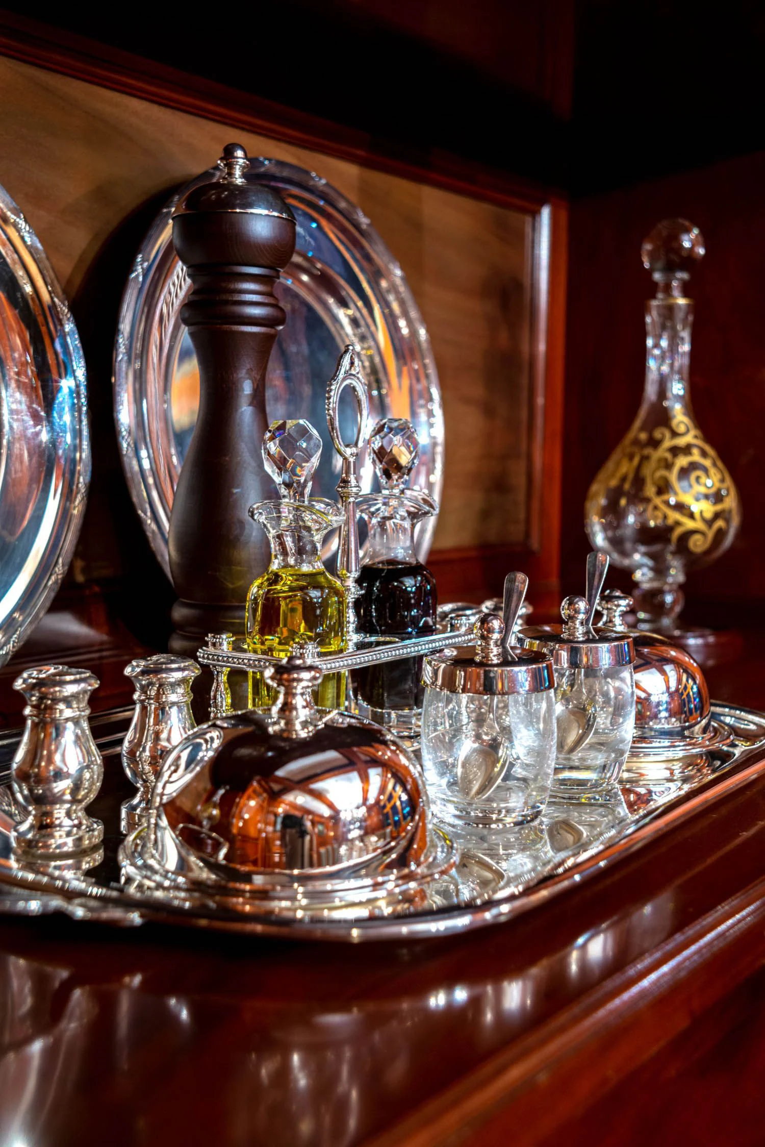 a glass case with a group of glasses on it aboard STEEL Yacht for Sale