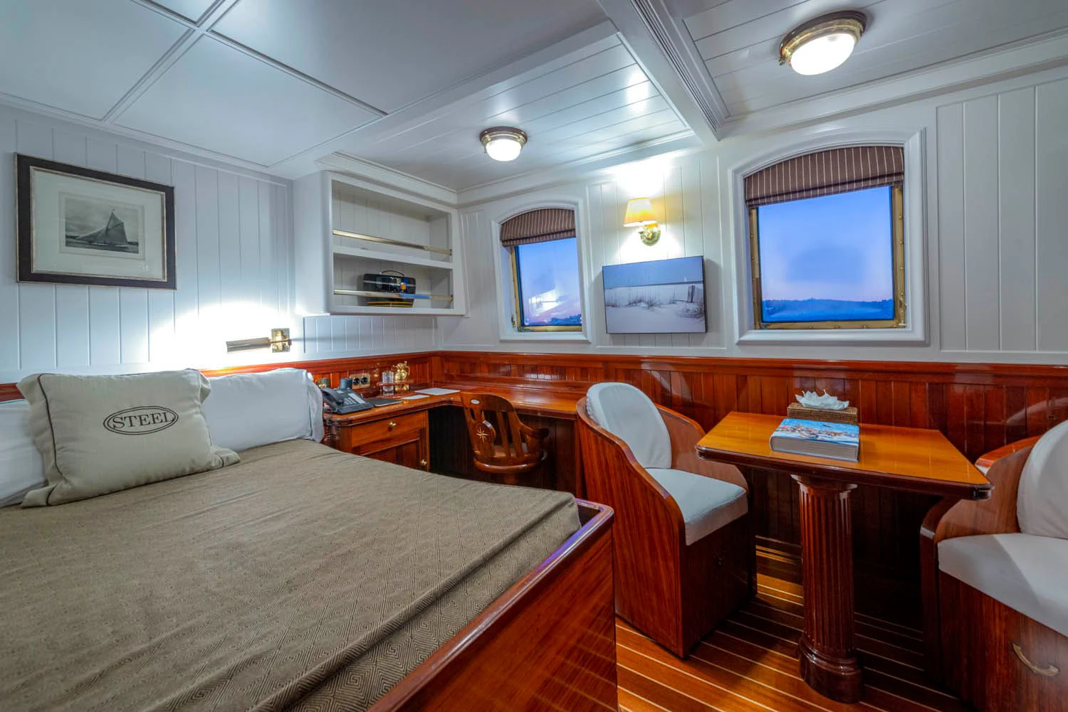 a room with a bed and a desk aboard STEEL Yacht for Sale