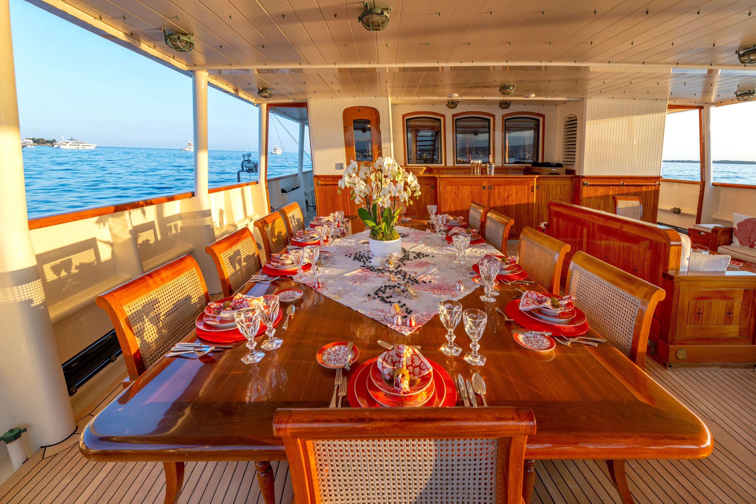 a dining room with a large table and chairs aboard STEEL Yacht for Sale