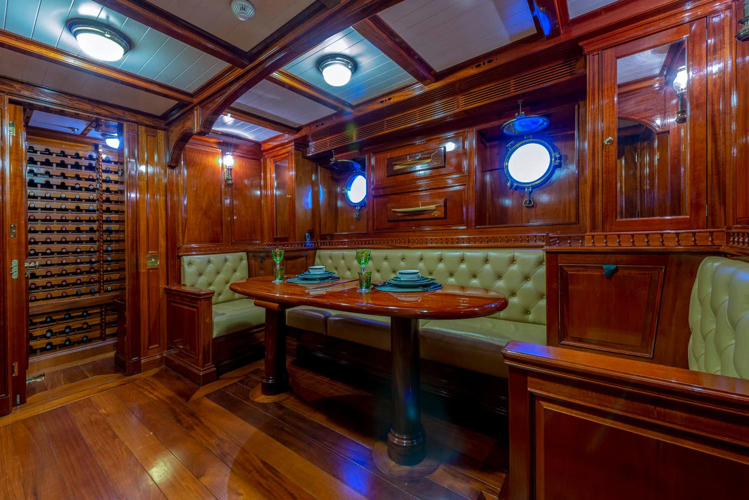 a room with a table and chairs aboard STEEL Yacht for Sale