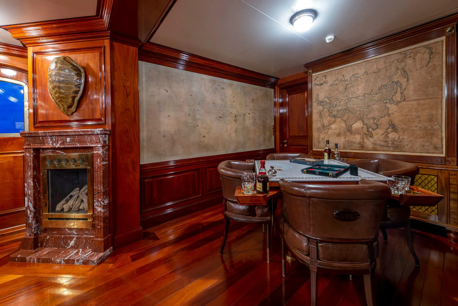 a dining room with a table and chairs aboard STEEL Yacht for Sale