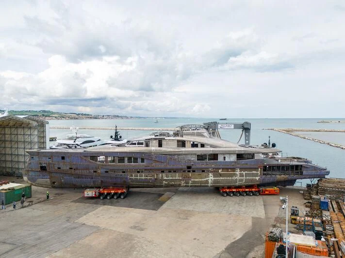 a large cruise ship docked aboard MADDAM C Yacht for Sale
