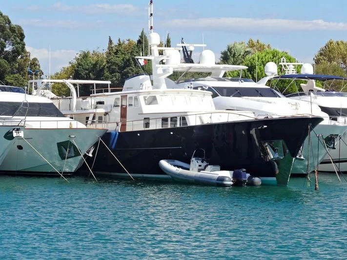 several boats docked at a pier aboard SANTA MARIA Yacht for Sale