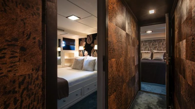 a room with a bed and a mirror aboard SANTA MARIA Yacht for Sale