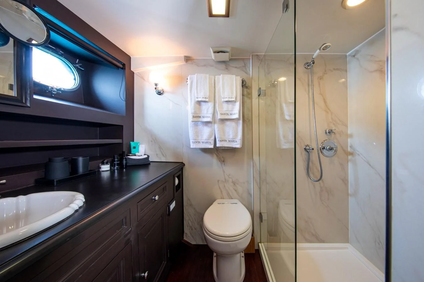 a bathroom with a shower sink and toilet aboard SANTA MARIA Yacht for Sale