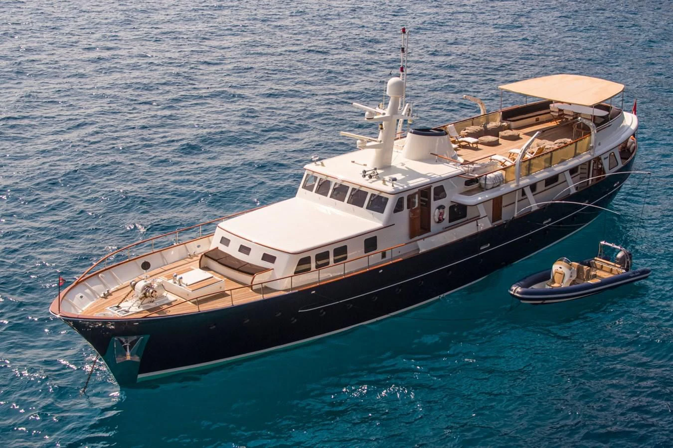 a boat with a couple of people on it aboard SANTA MARIA Yacht for Sale