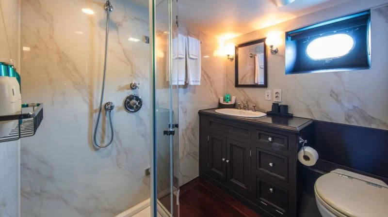 a bathroom with a glass shower aboard SANTA MARIA Yacht for Sale