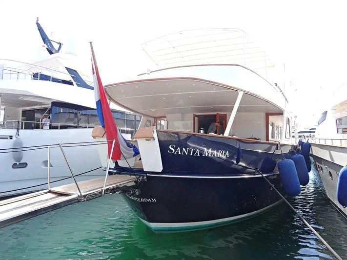 a boat docked at a pier aboard SANTA MARIA Yacht for Sale