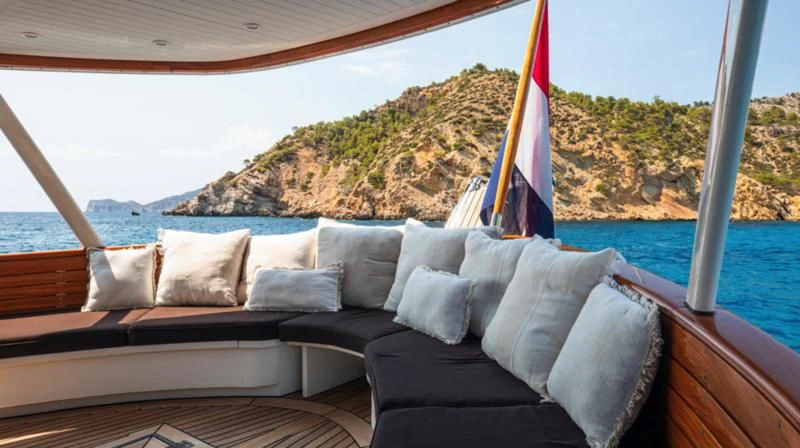 a large bed with pillows on it aboard SANTA MARIA Yacht for Sale