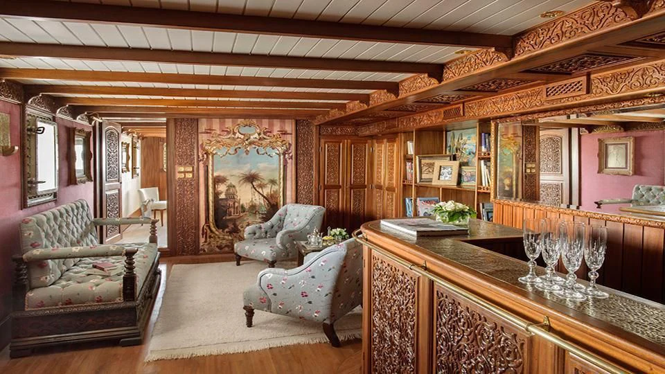 a room with a table chairs and a couch aboard NORTH SEA Yacht for Sale