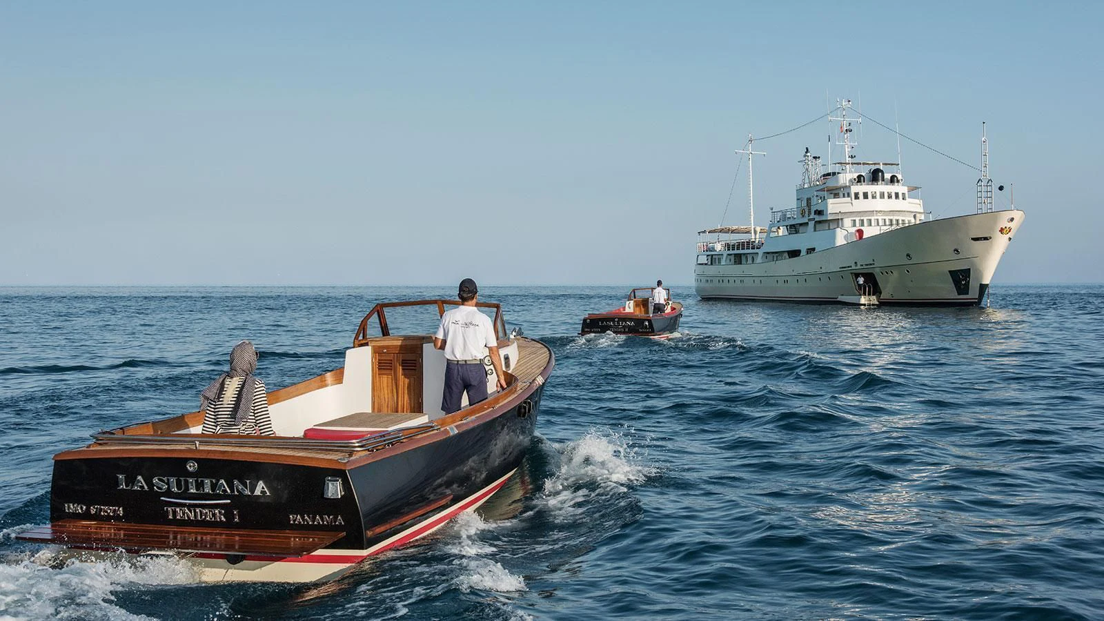 a couple of boats are in the water aboard NORTH SEA Yacht for Sale