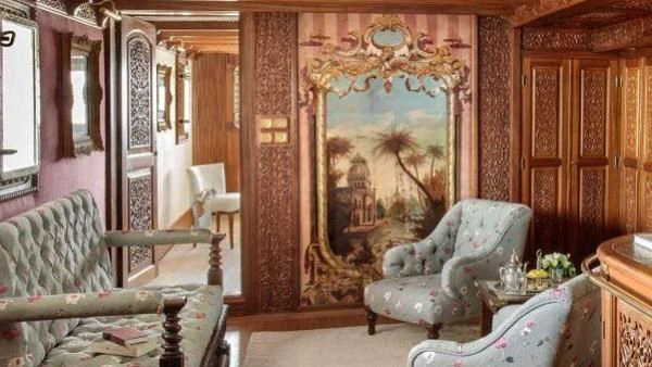 a room with a large mirror and a chair aboard NORTH SEA Yacht for Sale