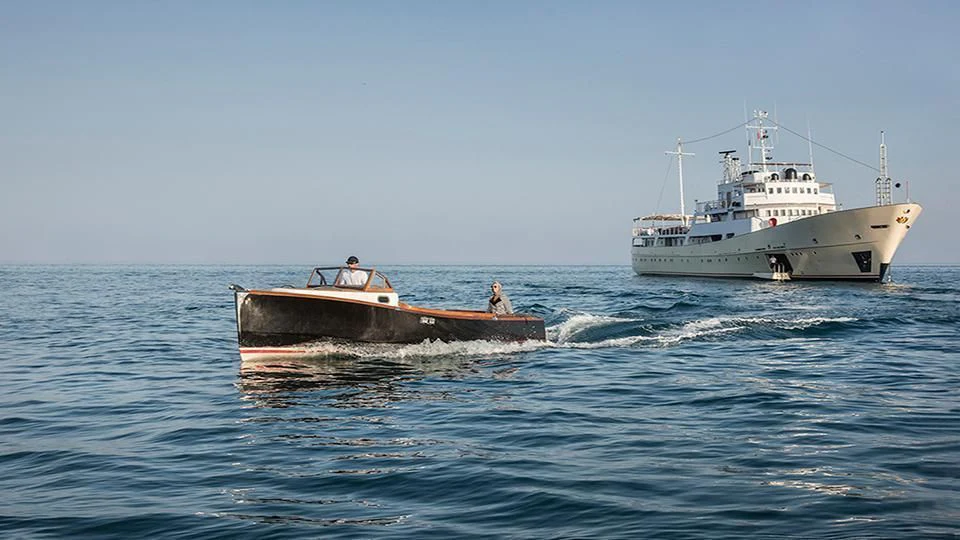 a boat and a boat in the water aboard NORTH SEA Yacht for Sale