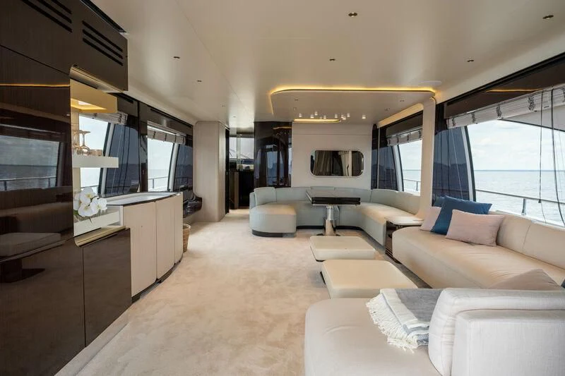 a living room with a couch and a tv aboard DIAMOND HANDS Yacht for Sale
