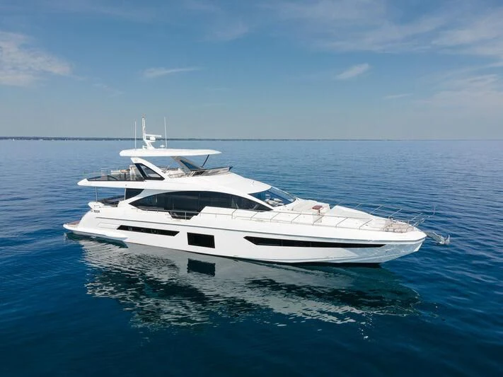 a white yacht in the water aboard DIAMOND HANDS Yacht for Sale