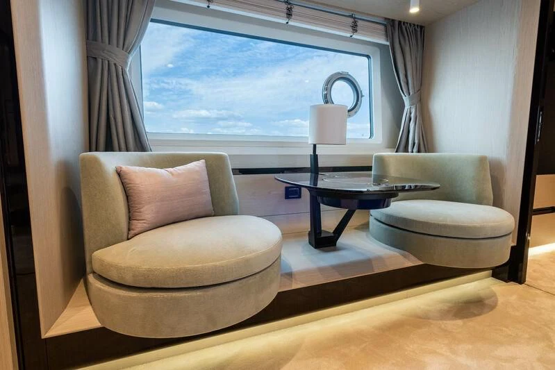 a living room with a large window aboard DIAMOND HANDS Yacht for Sale