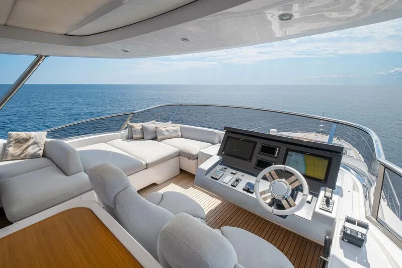 a white couch with a computer on it aboard DIAMOND HANDS Yacht for Sale