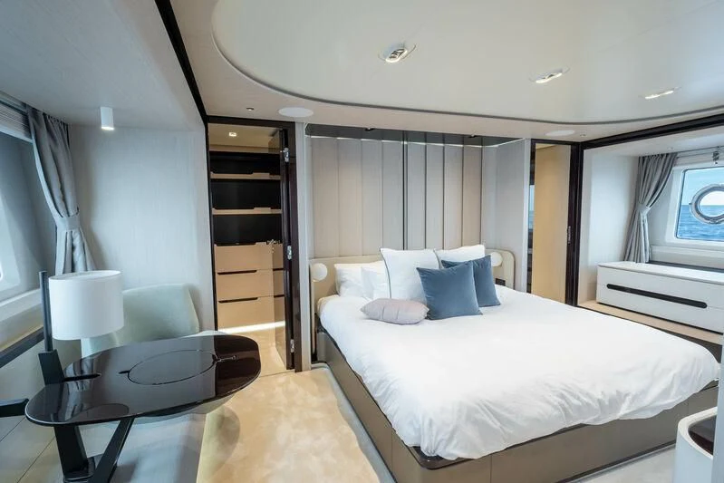 a hotel room with a bed and a desk aboard DIAMOND HANDS Yacht for Sale