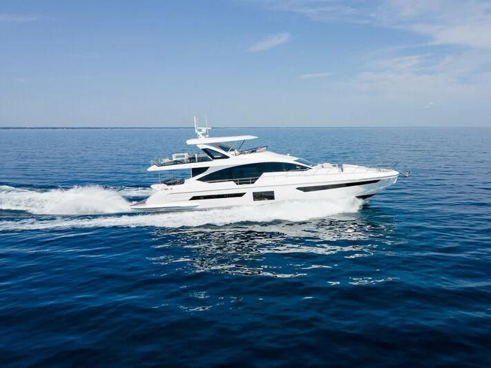 a white boat in the water aboard DIAMOND HANDS Yacht for Sale