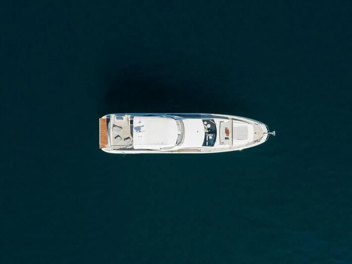 a small white boat aboard DIAMOND HANDS Yacht for Sale