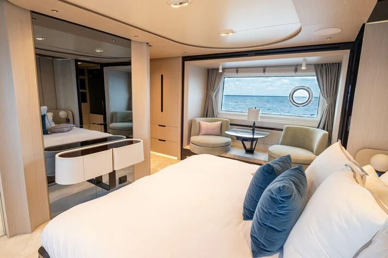a room with a bed and a window aboard DIAMOND HANDS Yacht for Sale