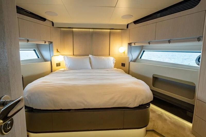 a bed with a white sheet aboard DIAMOND HANDS Yacht for Sale
