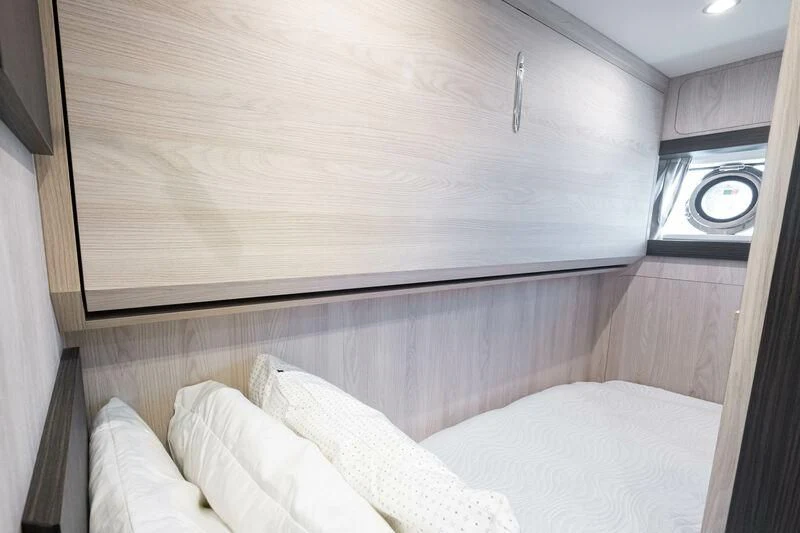a bed with white sheets aboard DIAMOND HANDS Yacht for Sale
