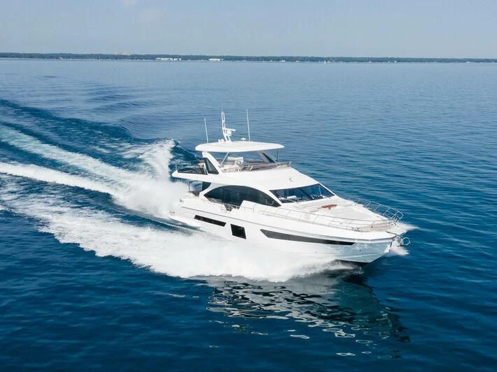 a white yacht on the water aboard DIAMOND HANDS Yacht for Sale