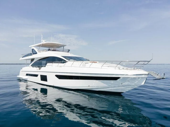 a white yacht in the water aboard DIAMOND HANDS Yacht for Sale