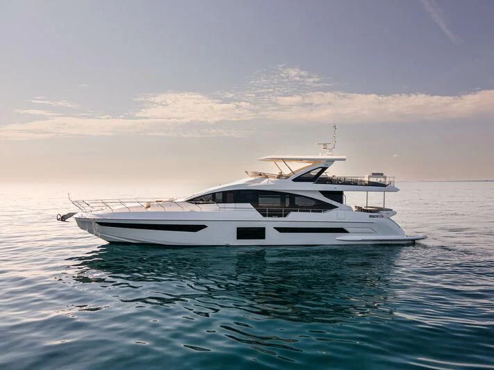 a white boat in the water aboard DIAMOND HANDS Yacht for Sale