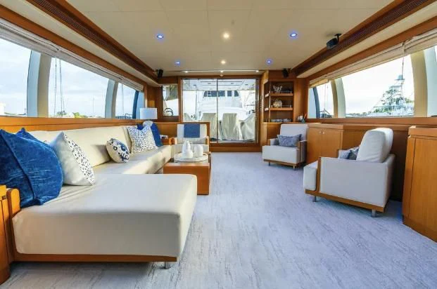 a living room with a couch and a table aboard VITAMIN SEA Yacht for Sale