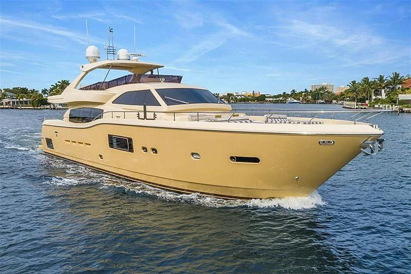a large yellow boat in the water aboard VITAMIN SEA Yacht for Sale
