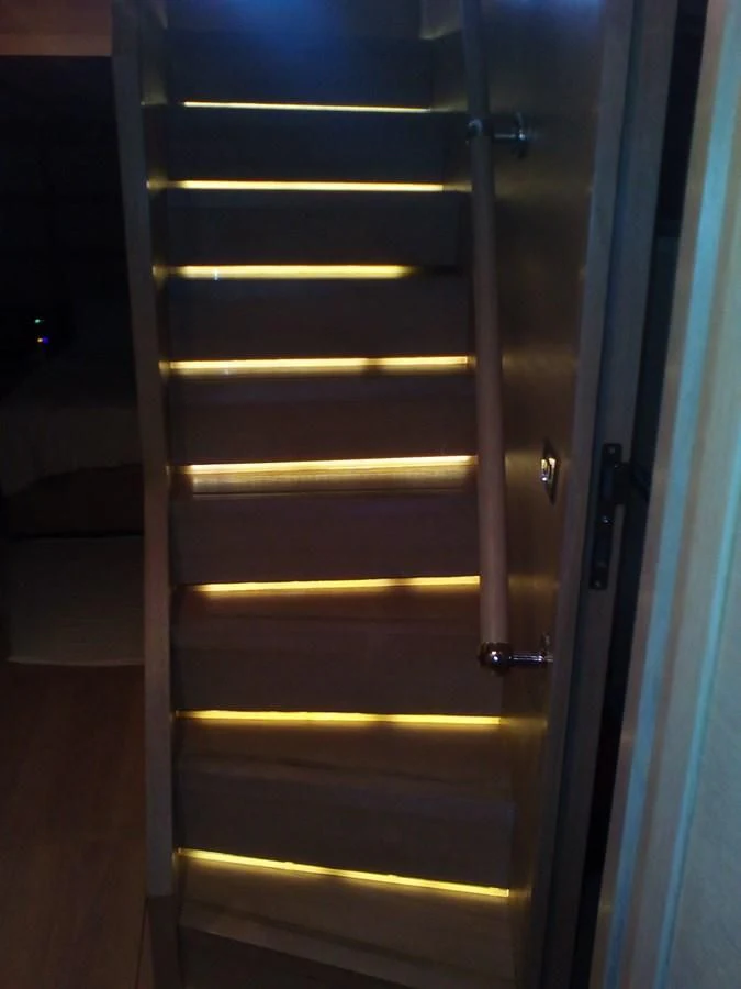 a white door with a light inside aboard SUN ANEMOS Yacht for Charter