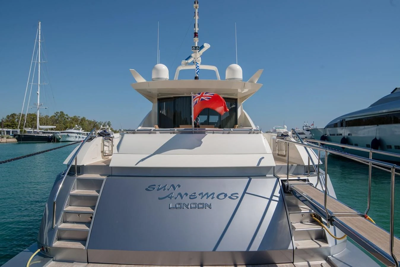 a boat docked at a pier aboard SUN ANEMOS Yacht for Charter