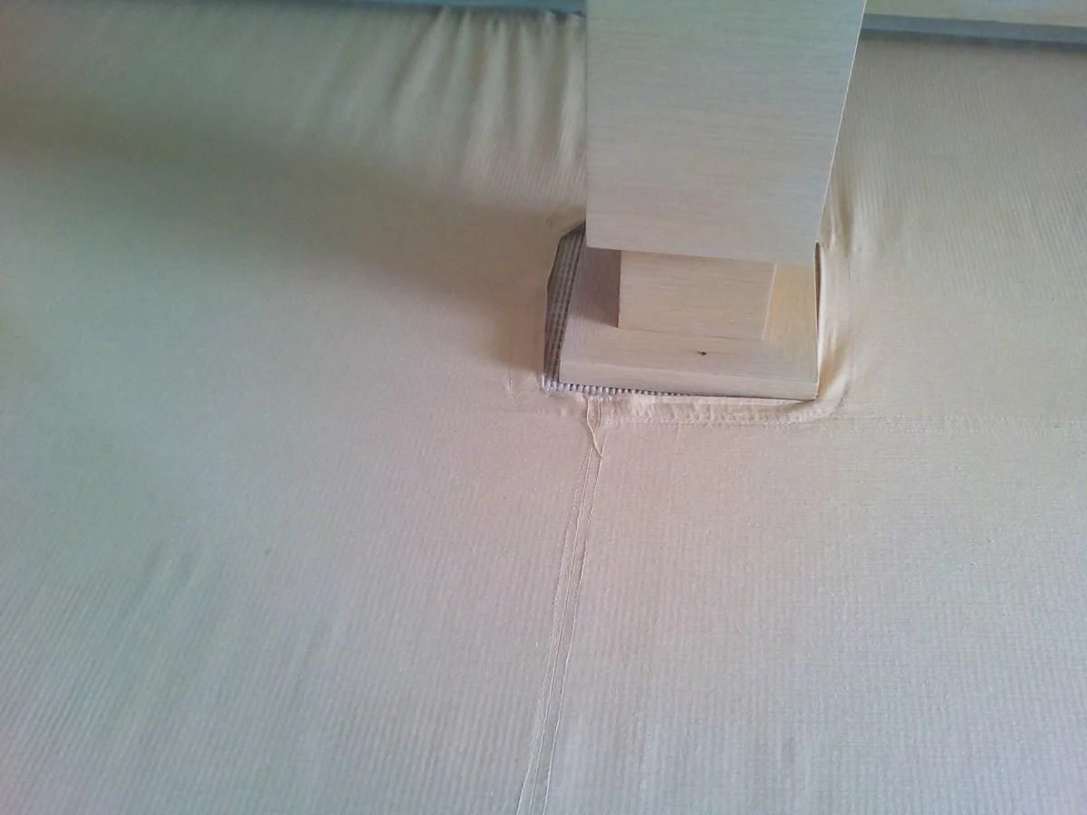 a white box on a bed aboard SUN ANEMOS Yacht for Charter