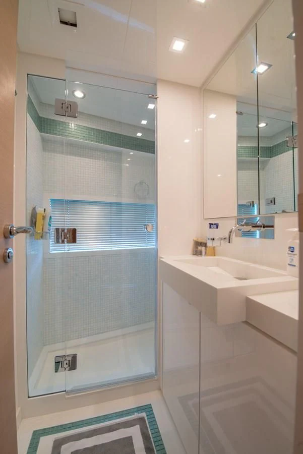 a bathroom with a glass shower aboard SUN ANEMOS Yacht for Charter